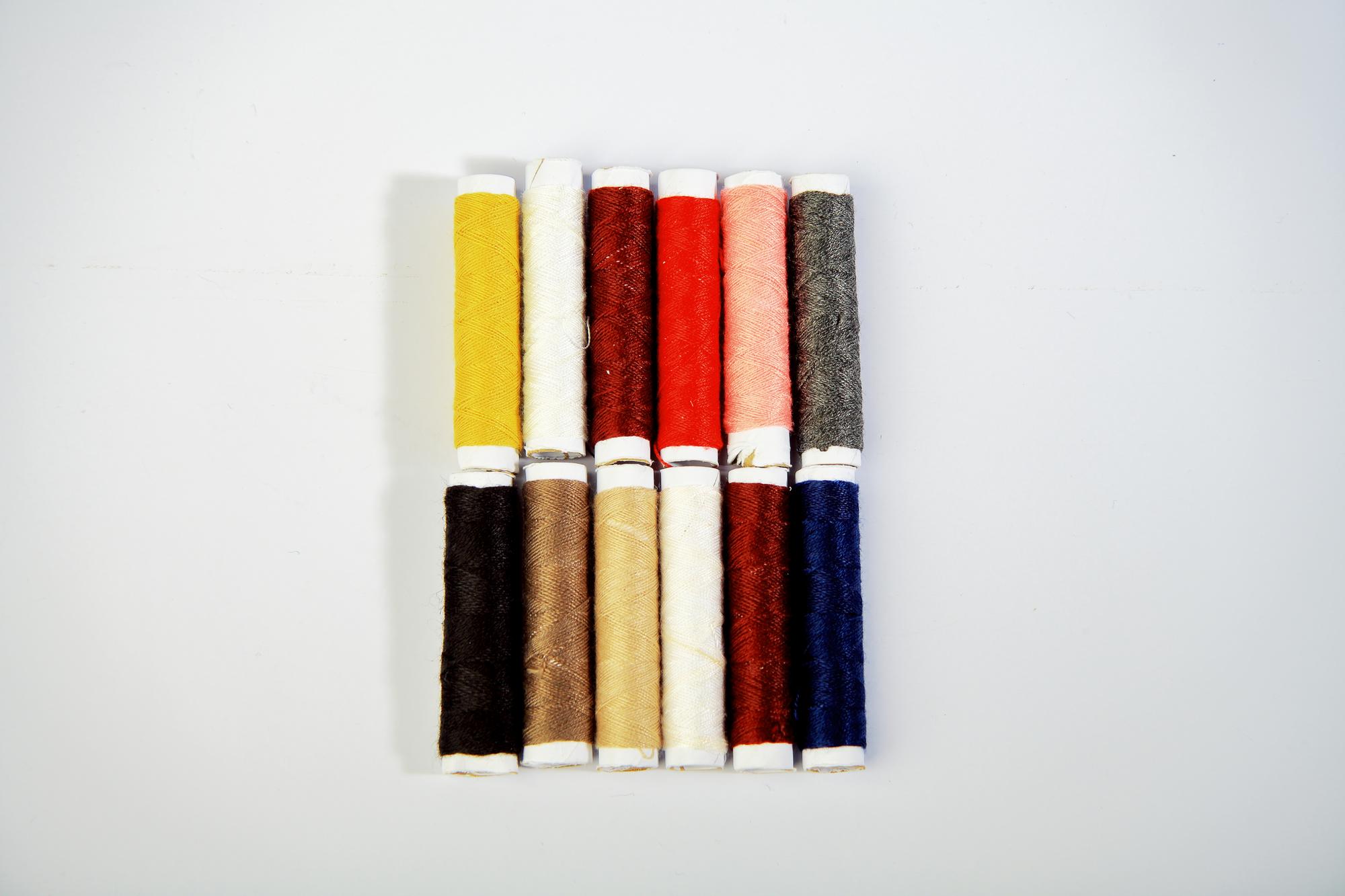 Stack of embroidered samples and swatches